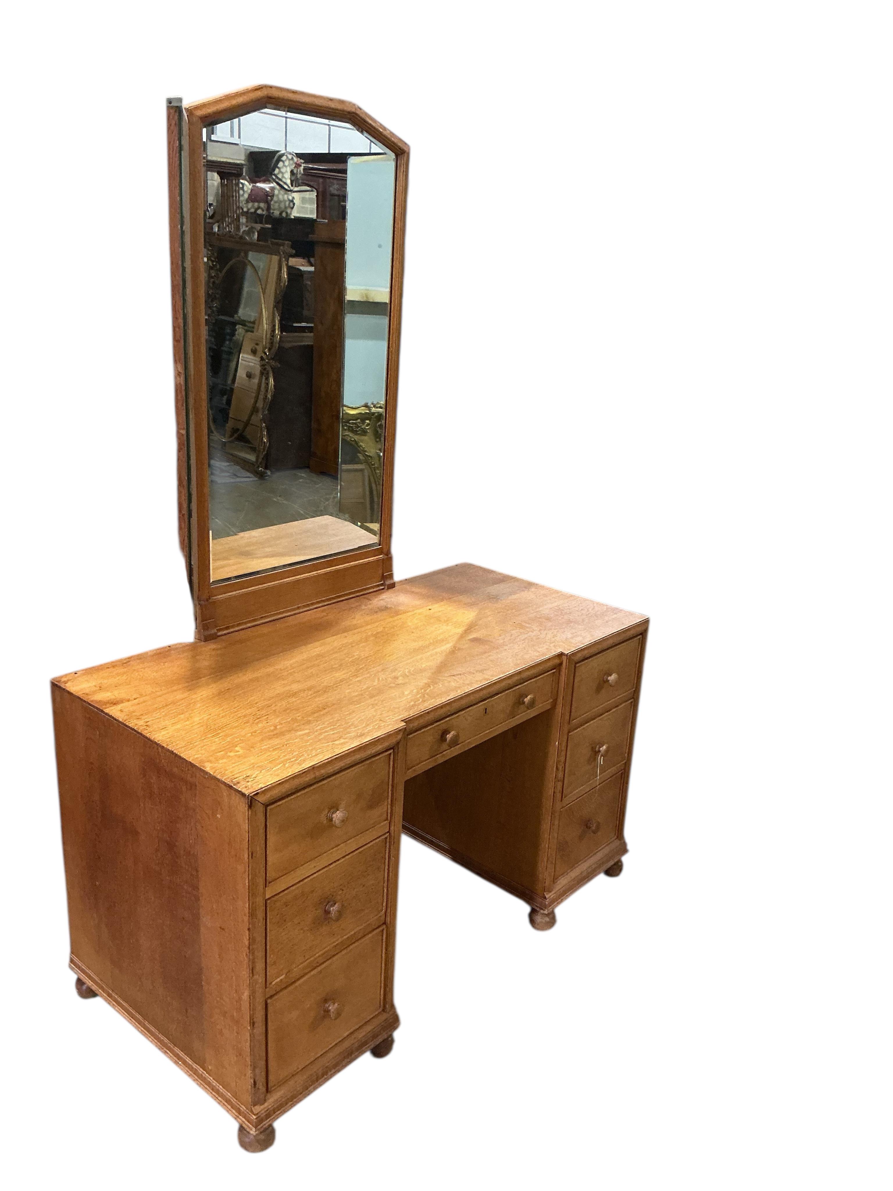 A Heals oak kneehole dressing table, width 114cm, depth 56cm, height 168cm